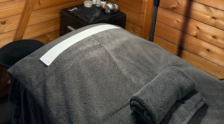 Cozy spa therapy bed at The Beauty Lounge, Wigston, England, GB, inviting relaxation and comfort.