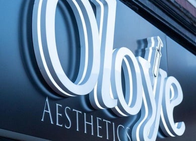 The Beauty Lounge - Wednesdays Only sign glows in Leicester, England, GB.