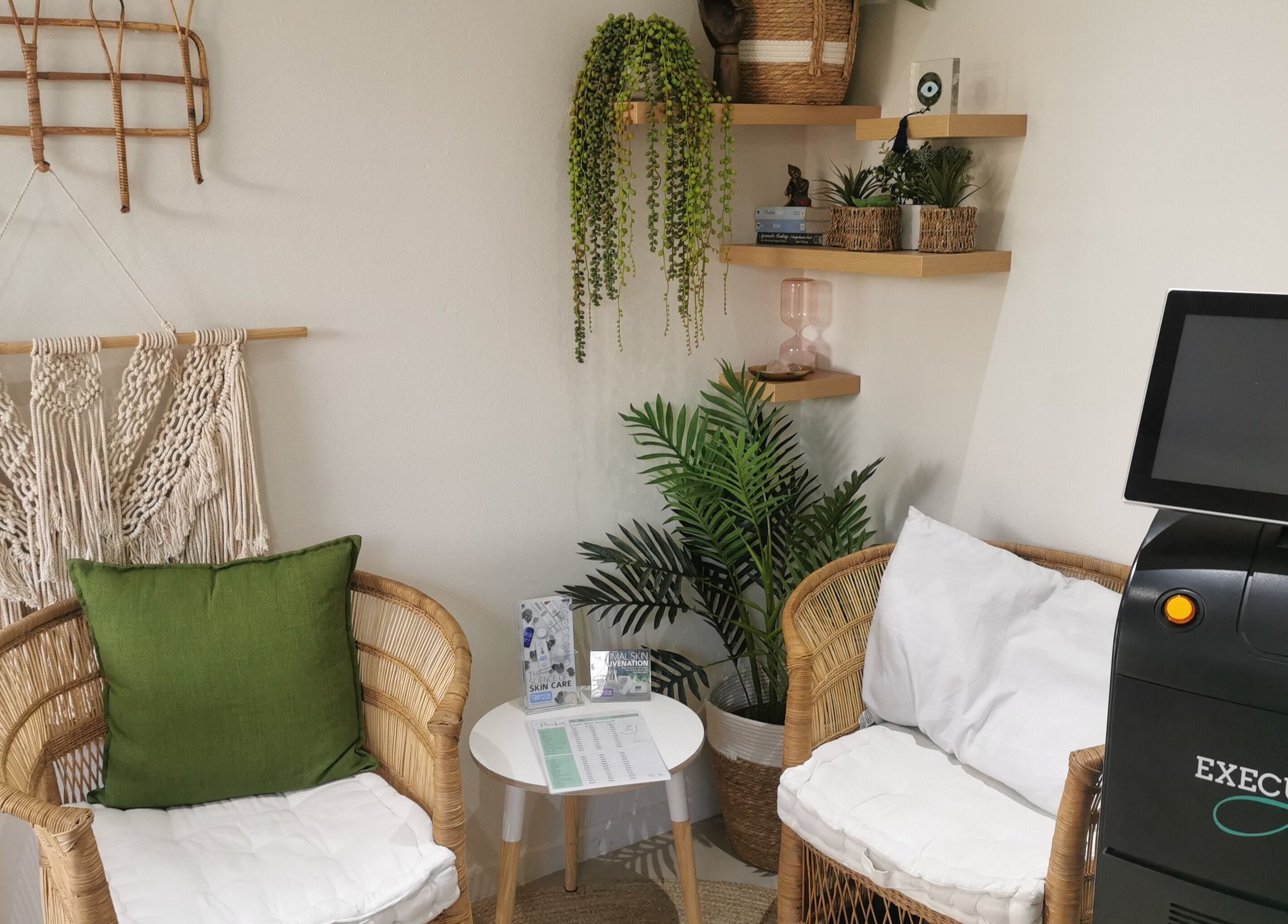 Inviting seating area at No Filter Laser and Aesthetics in Sandton, Gauteng, ZA with modern decor and laser equipment.