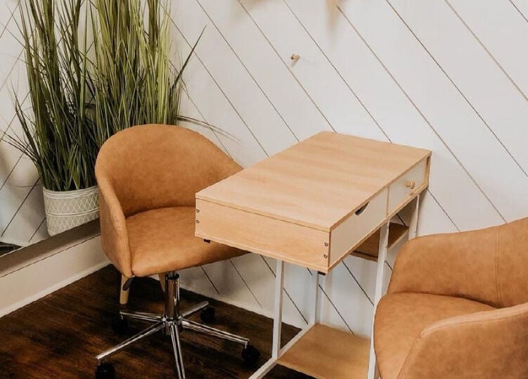 Cozy seating area with leather chairs at Kyana Britner with Texture+Sage, Fremont, Ohio, US.