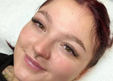 Woman with radiant skin and lash extensions at Saisma Beauty, Bournemouth, England, GB.