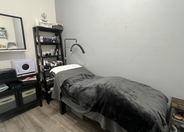 Cozy treatment room at Sugar and Stone Aesthetics, Kingston, Ontario, CA. Modern decor and equipment visible.