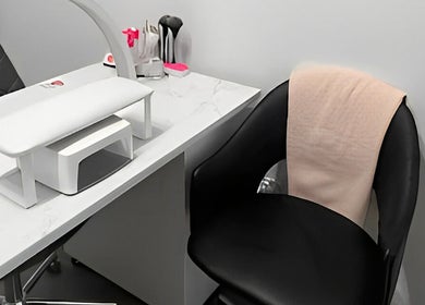 Modern nail station at Sugar and Stone Aesthetics, Kingston, Ontario, CA, featuring sleek design and comfortable seating.