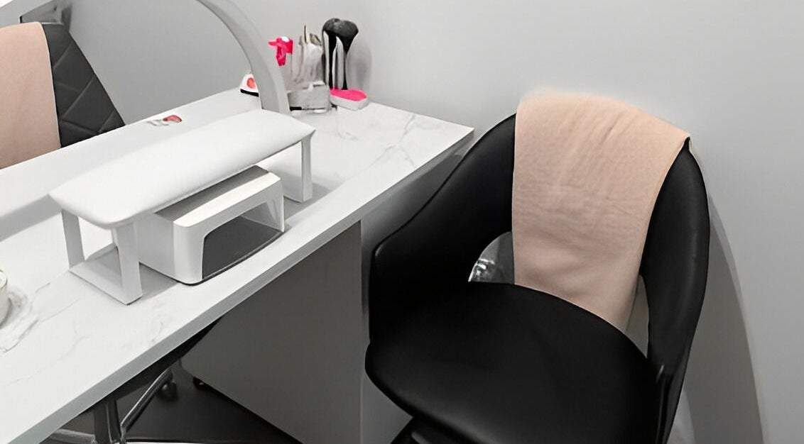 Modern nail station at Sugar and Stone Aesthetics, Kingston, Ontario, CA, featuring sleek design and comfortable seating.