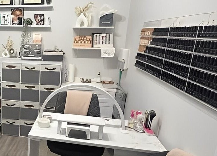 Nail salon station at Sugar and Stone Aesthetics in Kingston, Ontario, CA, featuring organized supplies.