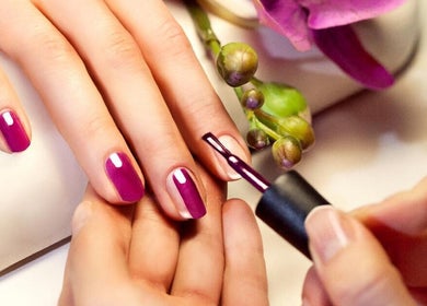 Manicured hands with vibrant nails at Q T NAILS, Santa Clara, California, US.