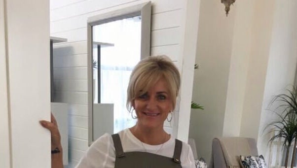 Jan Kelly welcomes clients at Jan’s Beauty Hub, Hope Island, Queensland, AU, offering a cozy and inviting space.