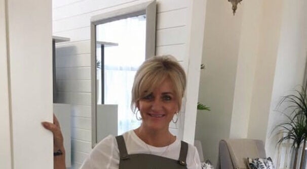 Jan Kelly welcomes clients at Jan’s Beauty Hub, Hope Island, Queensland, AU, offering a cozy and inviting space.