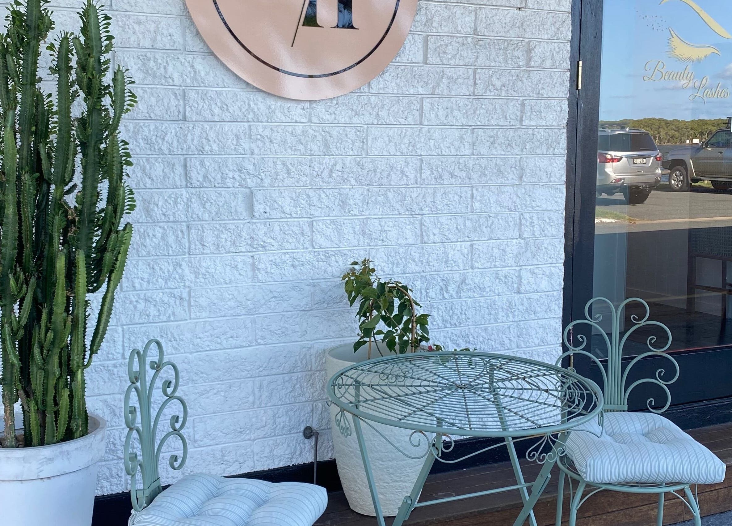 Charming outdoor seating at Jan Kelly at Jan’s Beauty Hub, Hope Island, Queensland, AU.