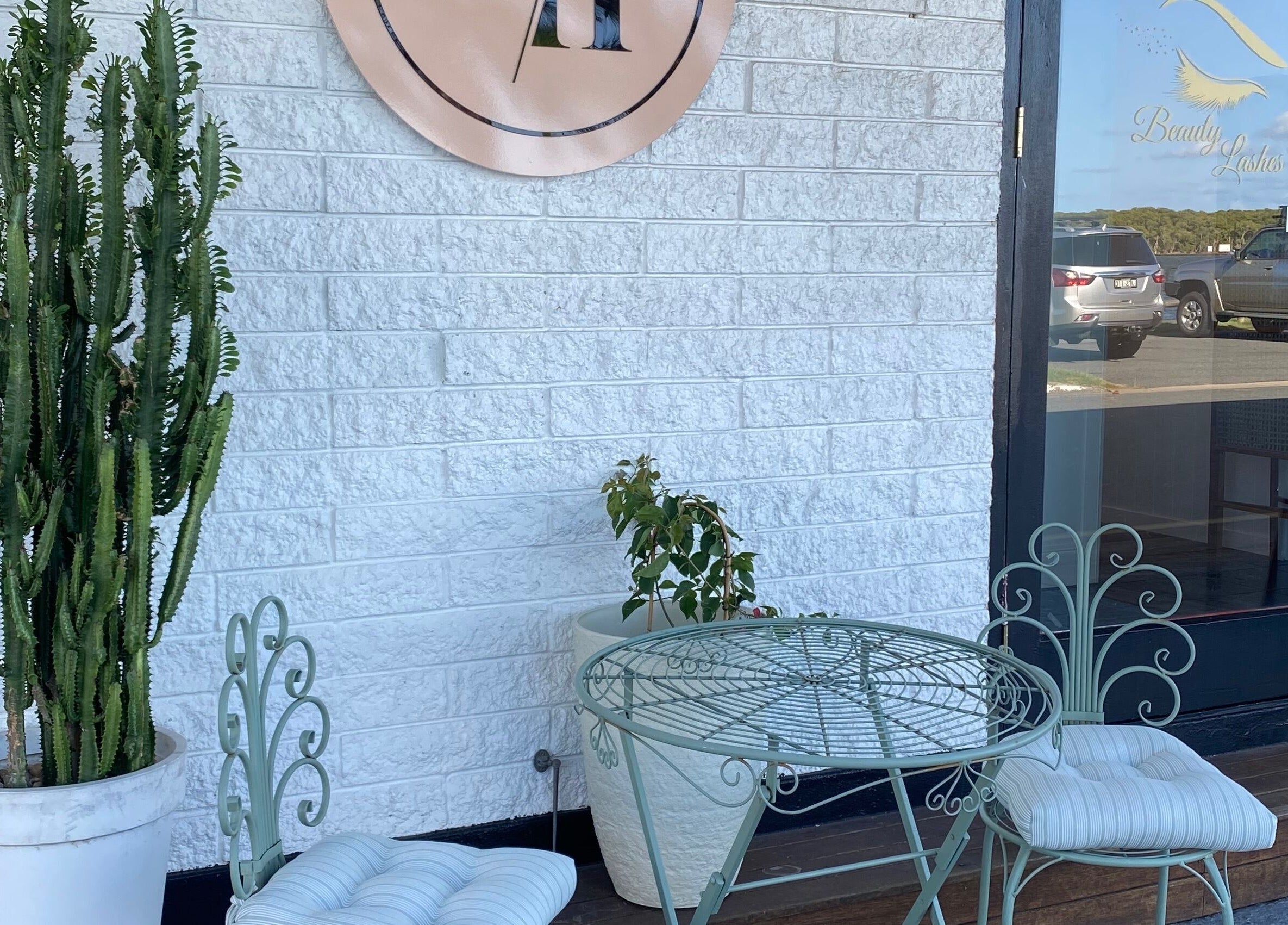 Charming outdoor seating at Jan Kelly at Jan’s Beauty Hub, Hope Island, Queensland, AU.
