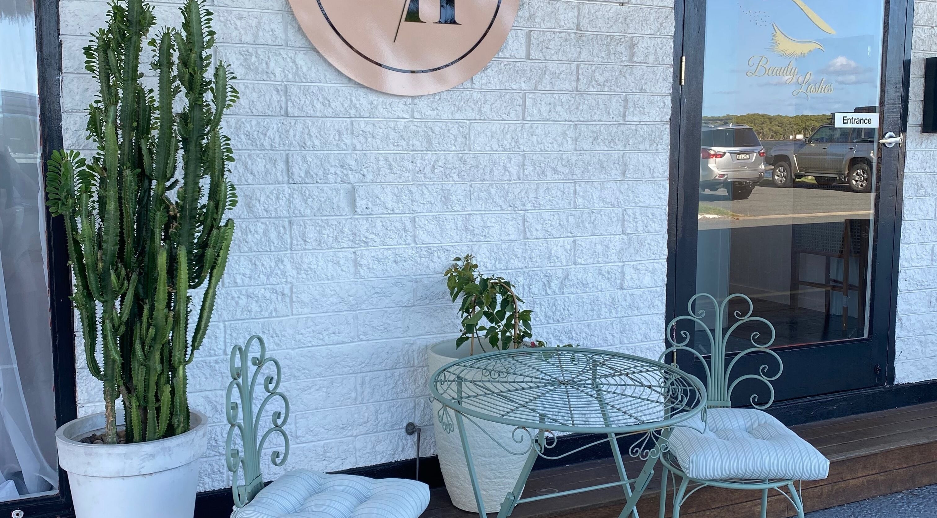 Charming outdoor seating at Jan Kelly at Jan’s Beauty Hub, Hope Island, Queensland, AU.