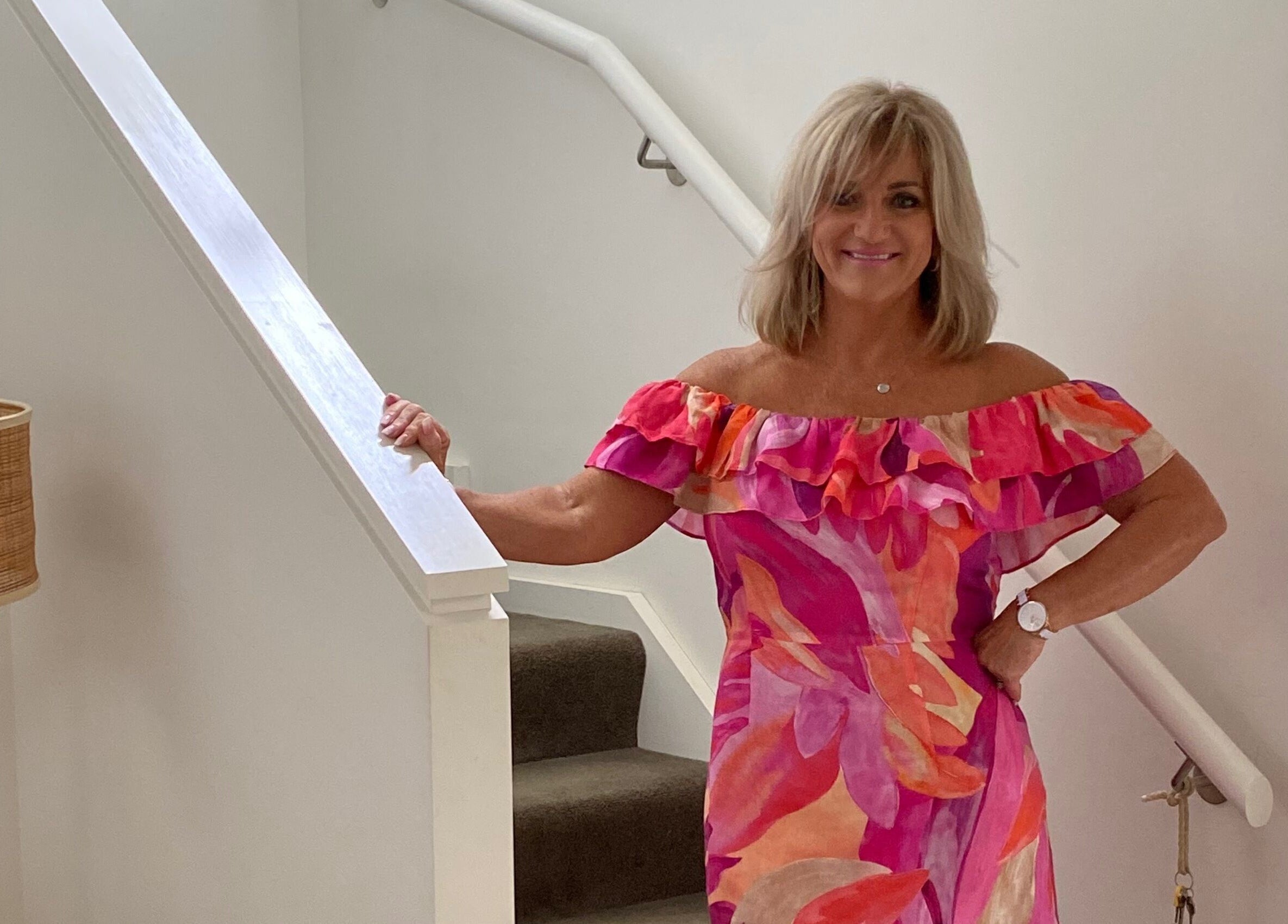 Jan Kelly at Jan’s Beauty Hub in a vibrant dress, Hope Island, Queensland, AU.