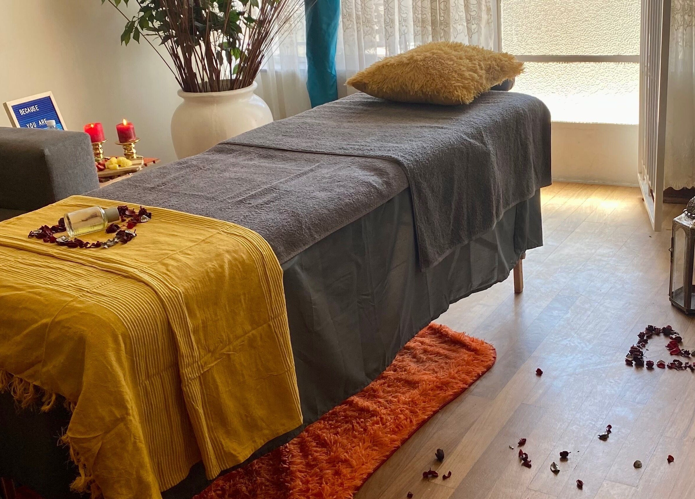 Relaxing spa setup at Browed by Pat, Johannesburg, Gauteng, ZA with candles and cozy massage table.
