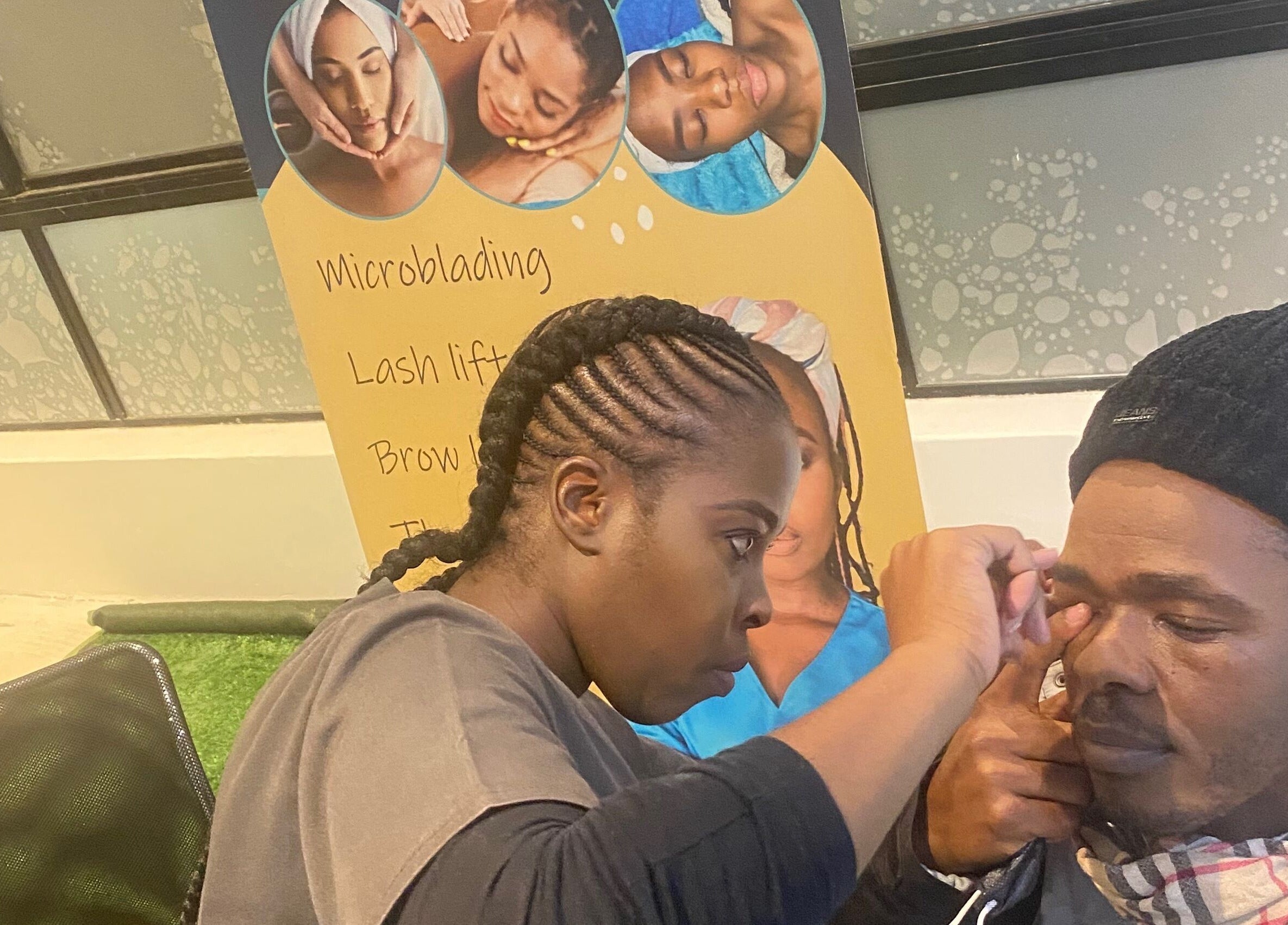 Artist skillfully shapes a client's brows at Browed by Pat, Johannesburg, Gauteng, ZA.