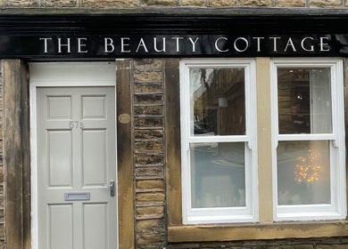 Front view of The Beauty Cottage in Almondbury, England, GB with charming stone facade.