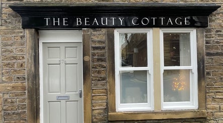 Front view of The Beauty Cottage in Almondbury, England, GB with charming stone facade.