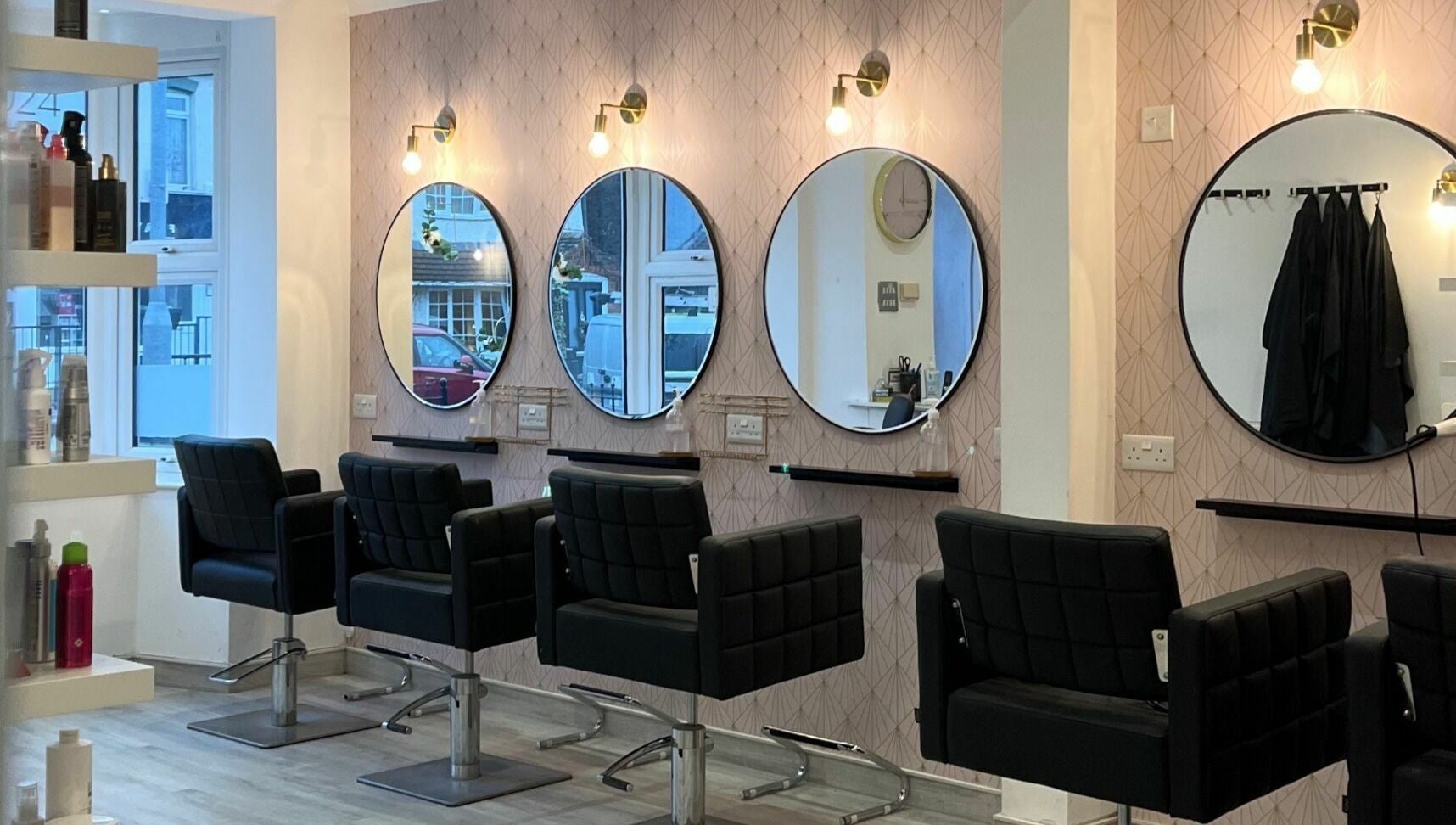 Elegant salon chairs and mirrors at Salon at 8 in Wroughton, England, GB, showcasing modern beauty ambiance.