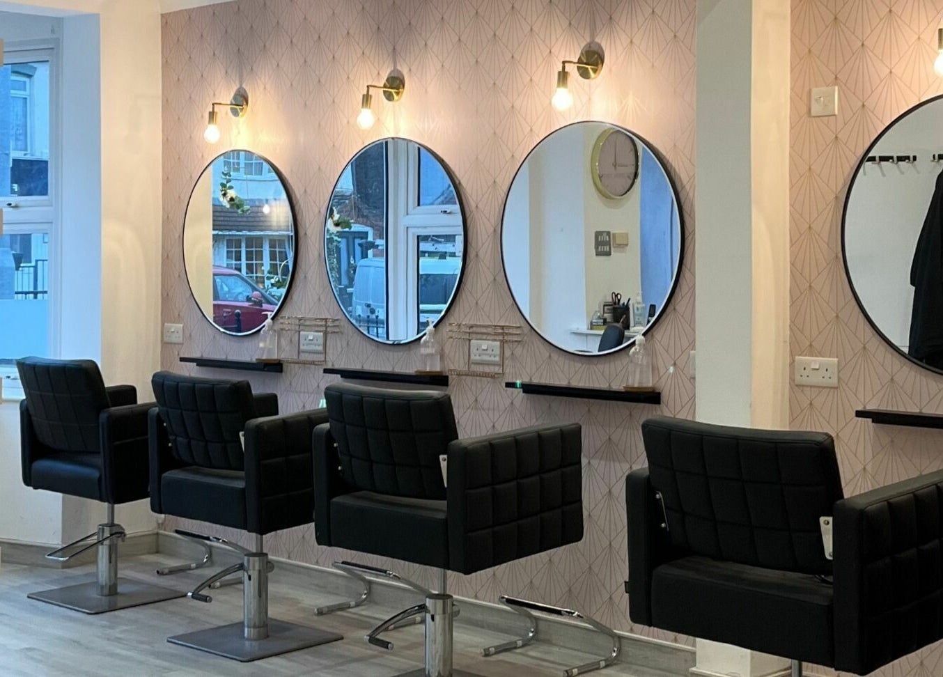 Elegant salon chairs and mirrors at Salon at 8 in Wroughton, England, GB, showcasing modern beauty ambiance.