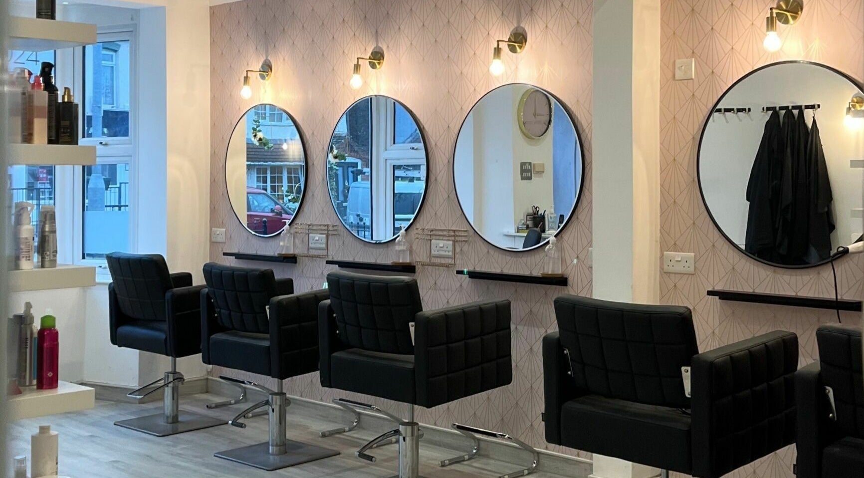 Elegant salon chairs and mirrors at Salon at 8 in Wroughton, England, GB, showcasing modern beauty ambiance.