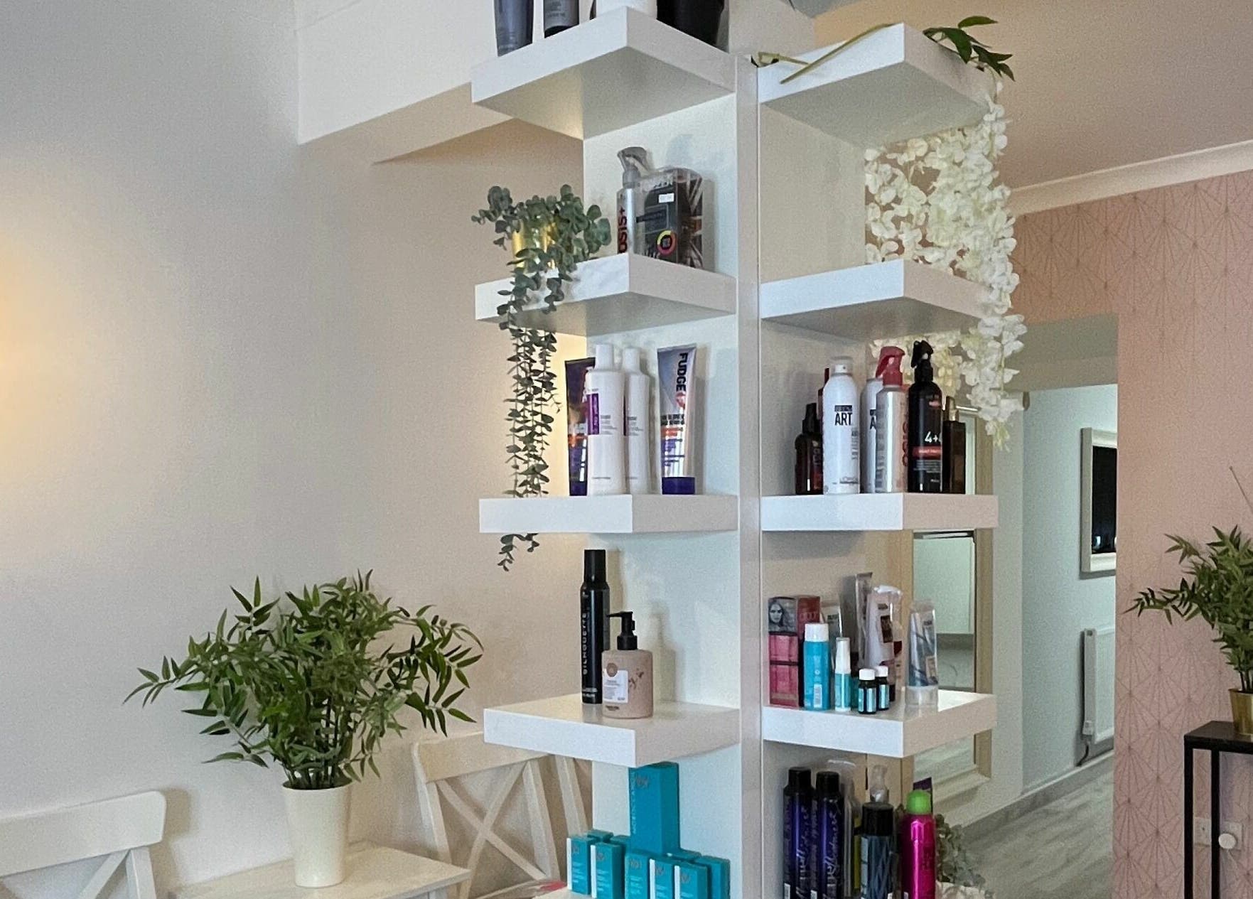 Stylish shelves with beauty products at Salon at 8 in Wroughton, England, GB, showcasing a serene ambiance.