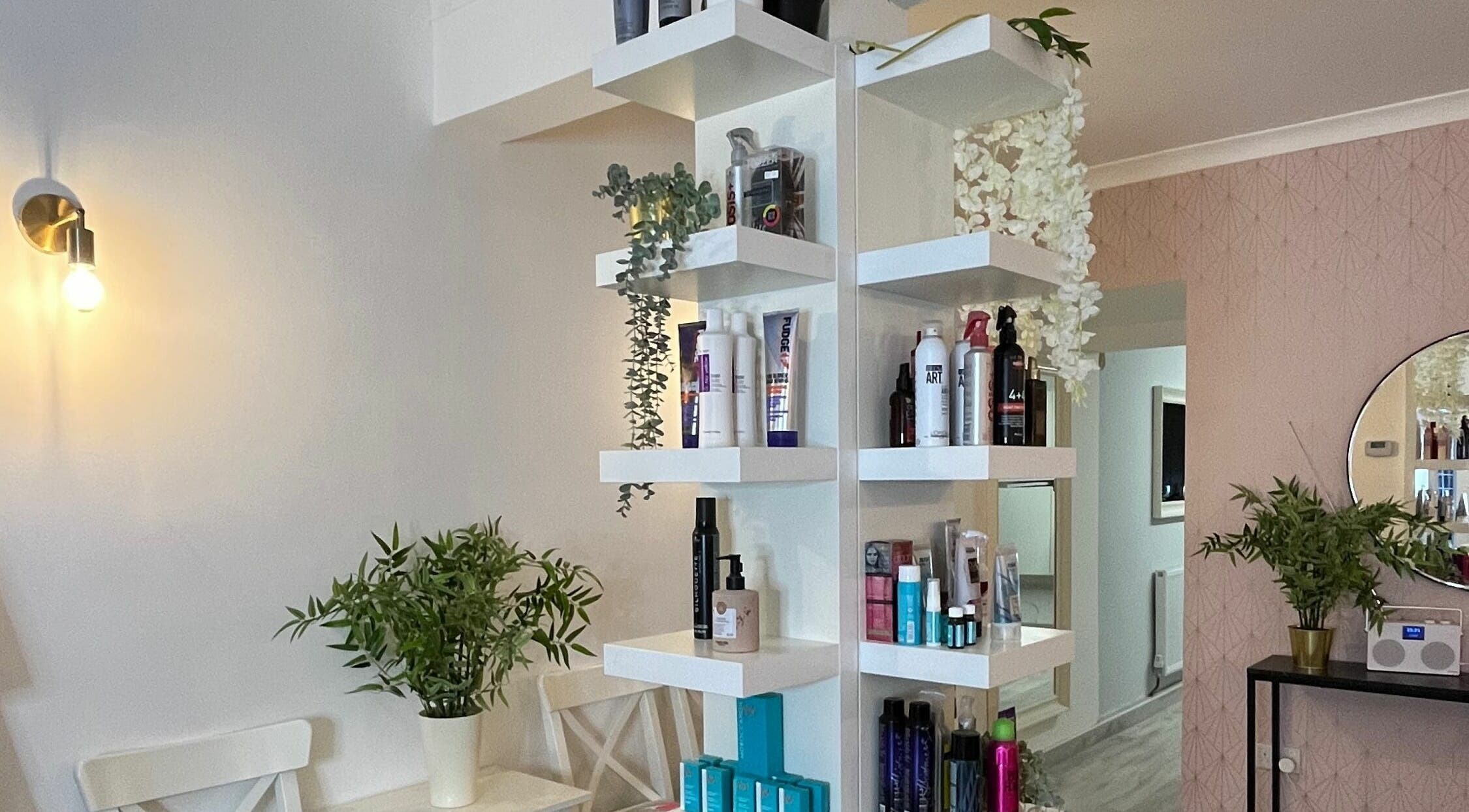 Stylish shelves with beauty products at Salon at 8 in Wroughton, England, GB, showcasing a serene ambiance.