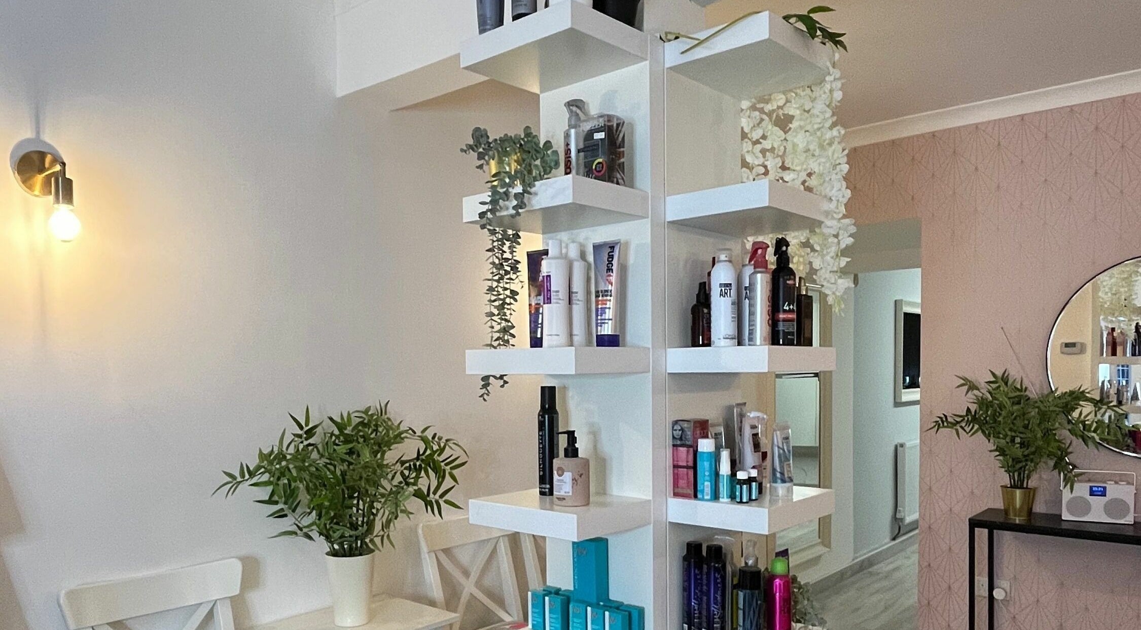 Stylish shelves with beauty products at Salon at 8 in Wroughton, England, GB, showcasing a serene ambiance.