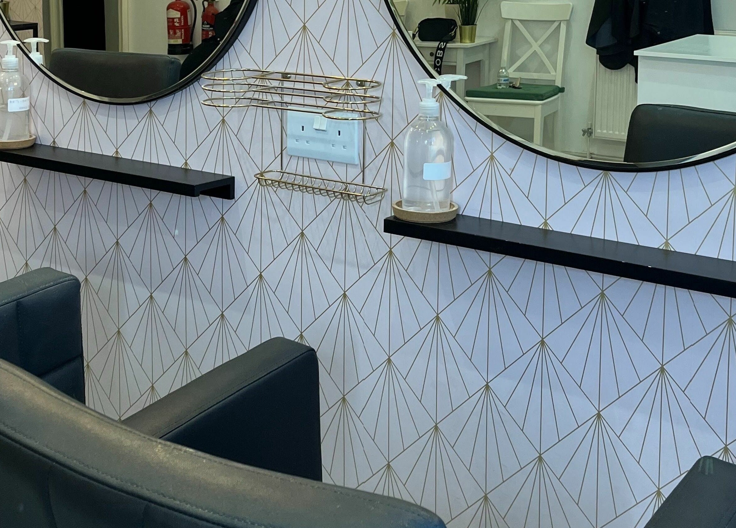 Stylish salon interior at Salon at 8, Wroughton, England, GB, showcasing chic decor and mirrors.