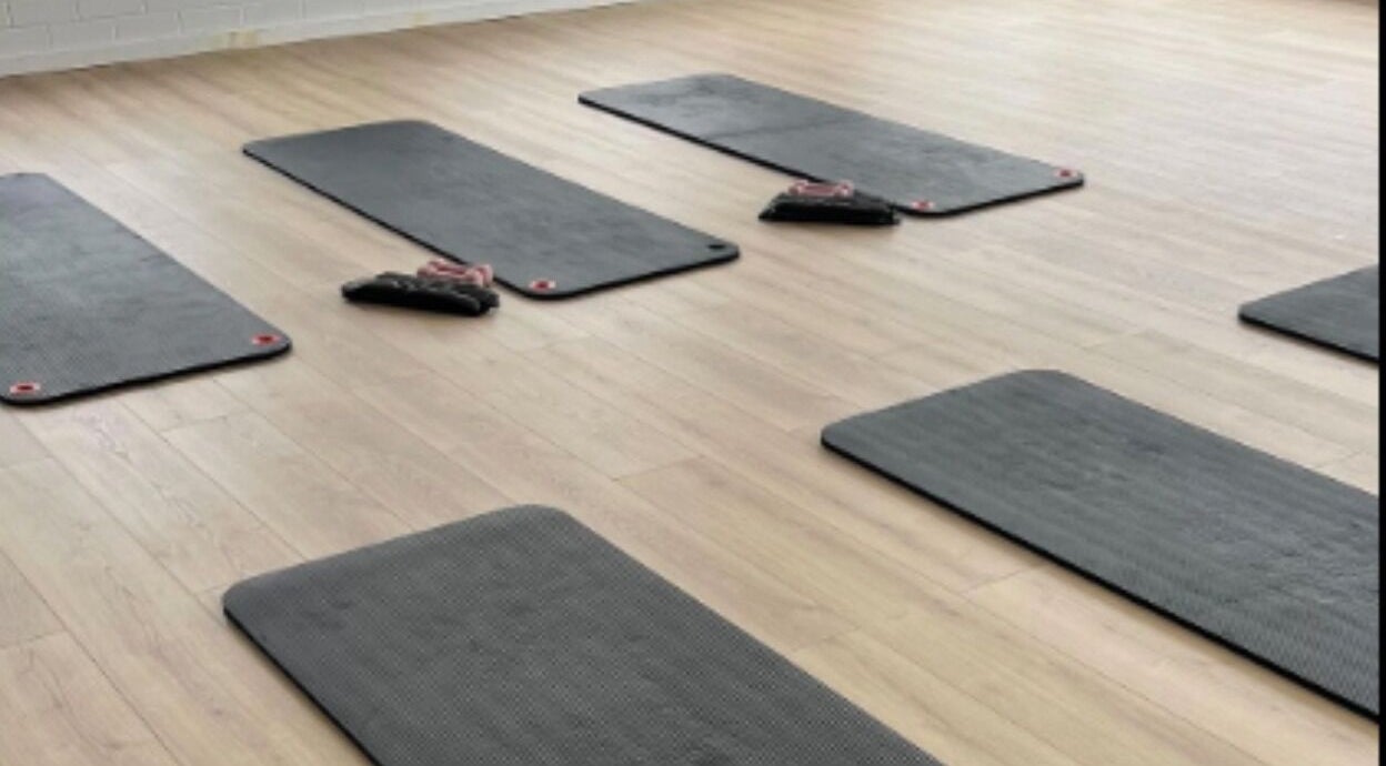 Yoga mats neatly arranged at Bodhifit Studio & Wellness in Fyshwick, Australian Capital Territory, AU.