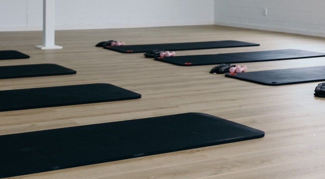 Yoga mats lined up at Bodhifit Studio & Wellness, Fyshwick, Australian Capital Territory, AU.