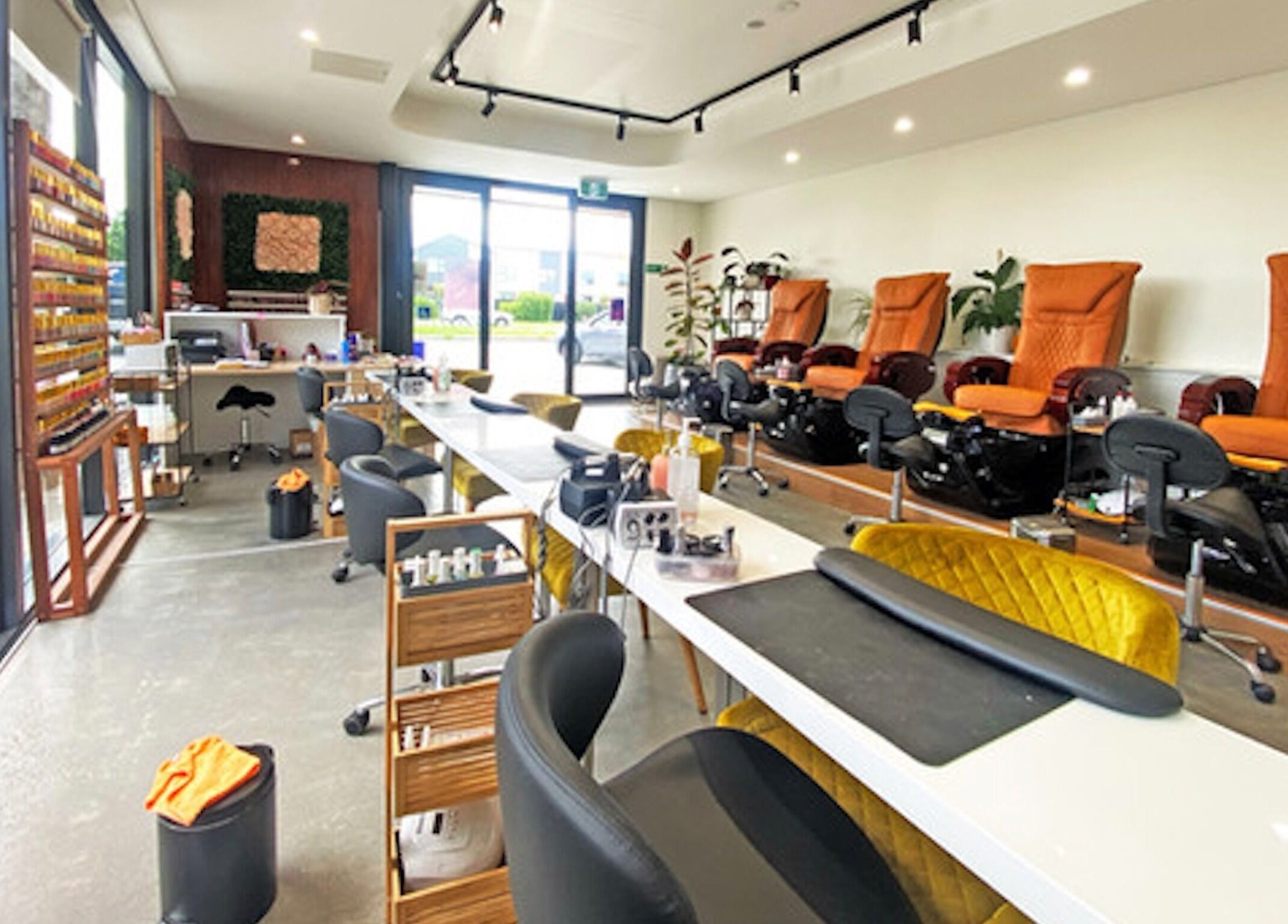 Interior of Bella Signature Nails in Auckland, NZ showcasing cozy manicure and pedicure stations.