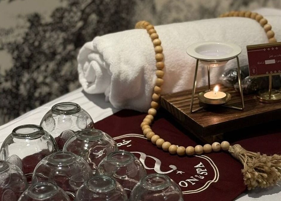 Relaxing spa setup with glass cups, candle, and towel at Ghumra I غمرة, Dhahran, Eastern Province, SA.