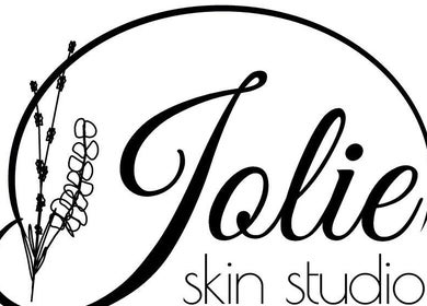 Jolie Skin Studio logo featuring elegant floral design, Austin, Texas, US.