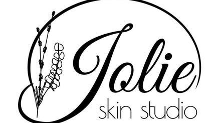 Jolie Skin Studio logo featuring elegant font and floral design, located in Austin, Texas, US.
