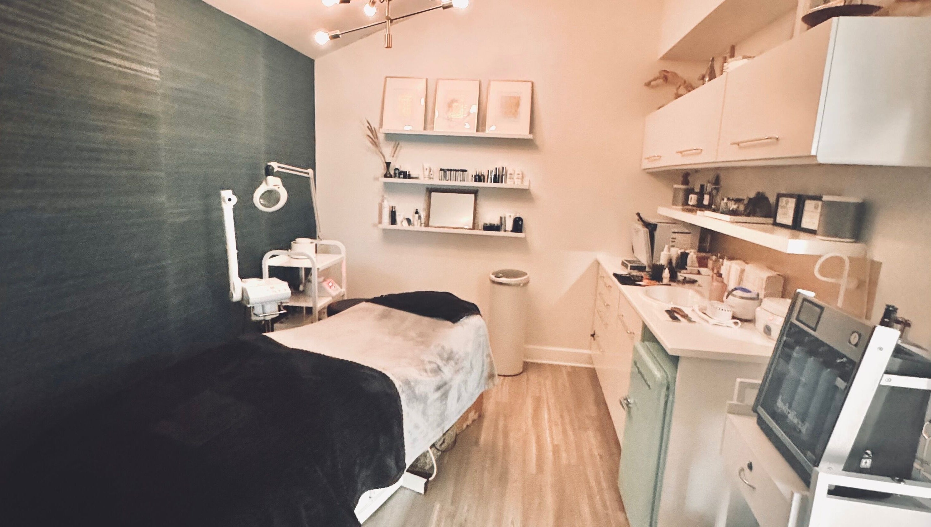Elegant treatment room at Jolie Skin Studio in Austin, Texas, US, featuring modern spa amenities.