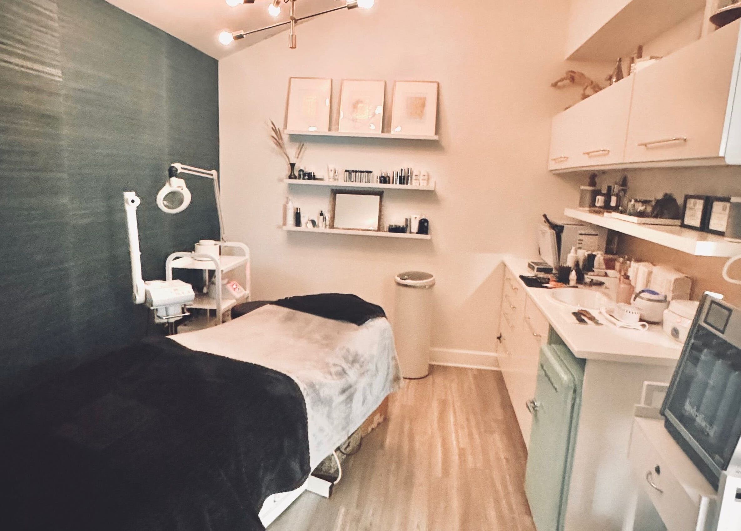 Elegant treatment room at Jolie Skin Studio in Austin, Texas, US, featuring modern spa amenities.