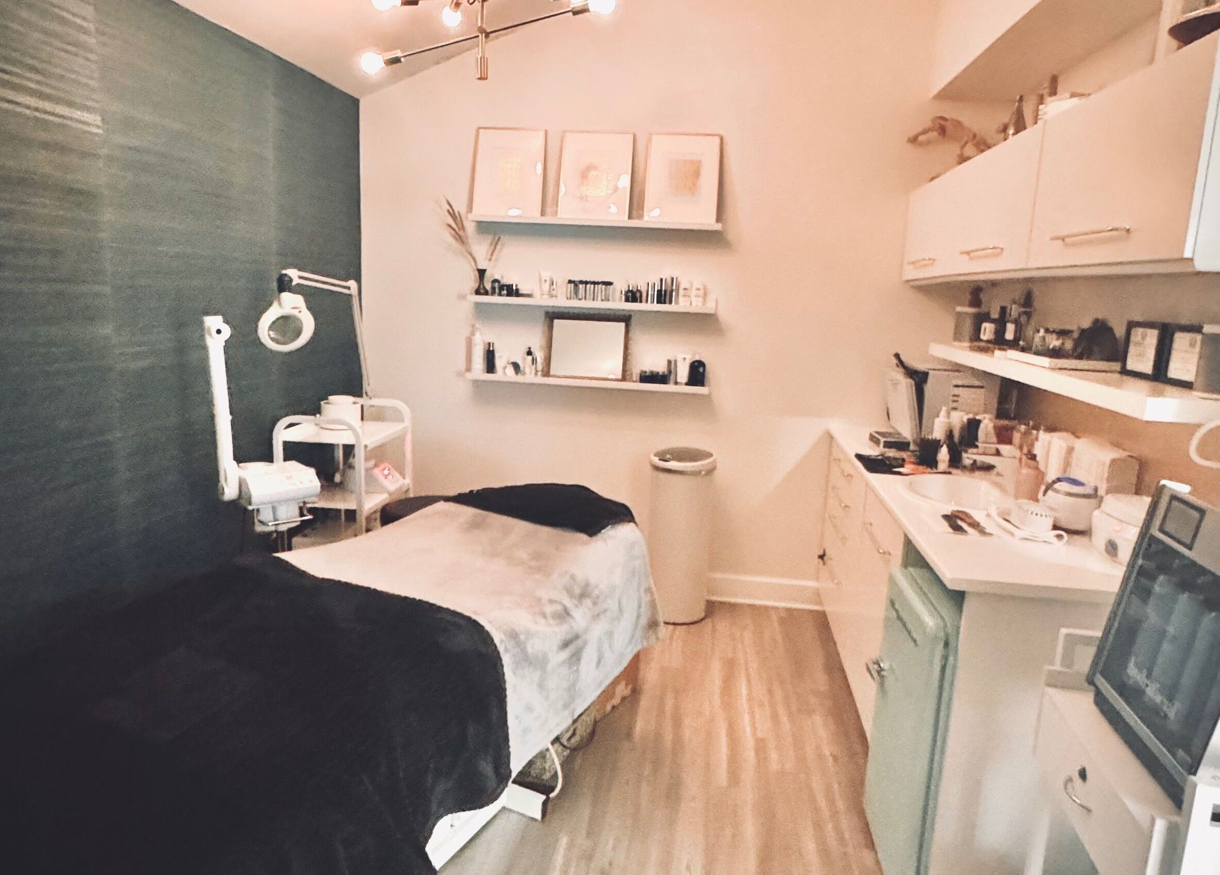Elegant treatment room at Jolie Skin Studio in Austin, Texas, US, featuring modern spa amenities.