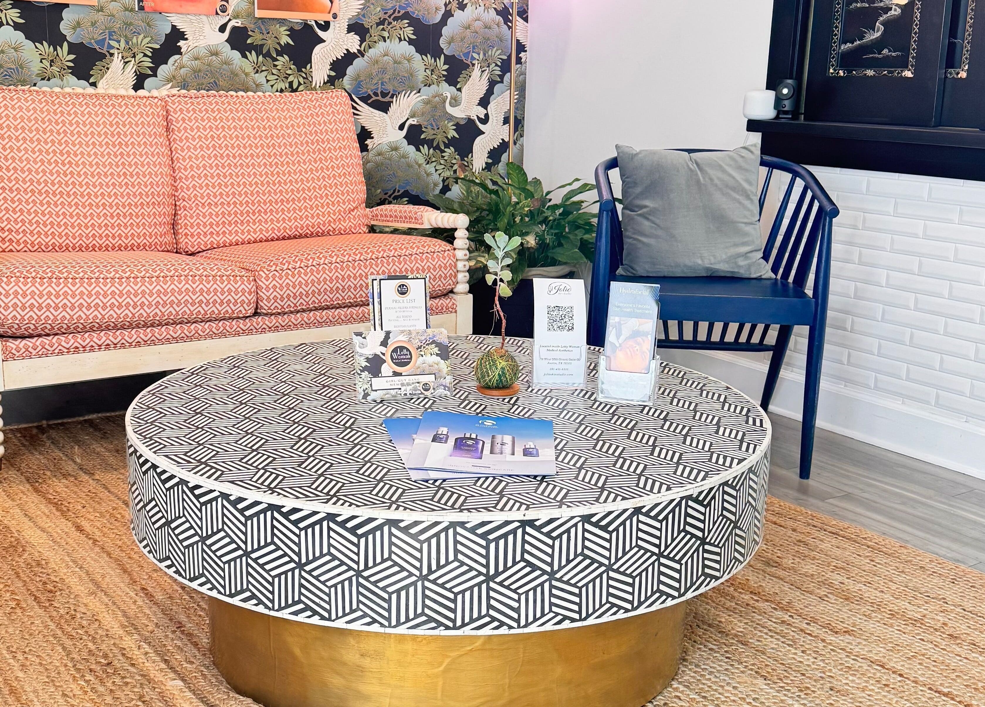 Welcoming lounge at Jolie Skin Studio in Austin, Texas, US with elegant seating and decor.