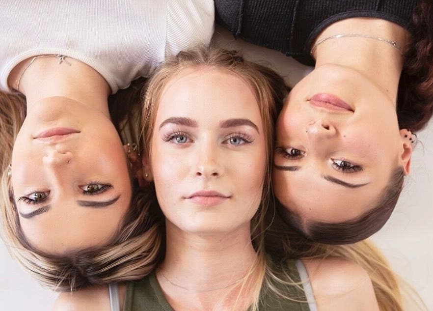 Three women showcase beauty at Lush Lash Ariana, Kapiti, Wellington, NZ, highlighting natural elegance.