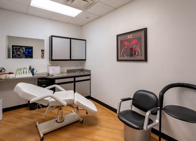 Modern treatment room at Fantasy Sports Cuts, Fayetteville, Arkansas, US, featuring stylish furnishings.
