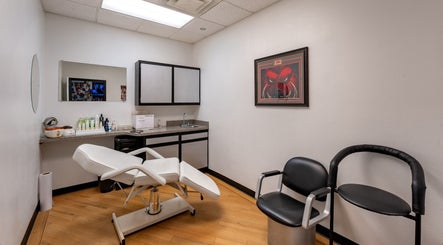 Modern treatment room at Fantasy Sports Cuts, Fayetteville, Arkansas, US, featuring stylish furnishings.