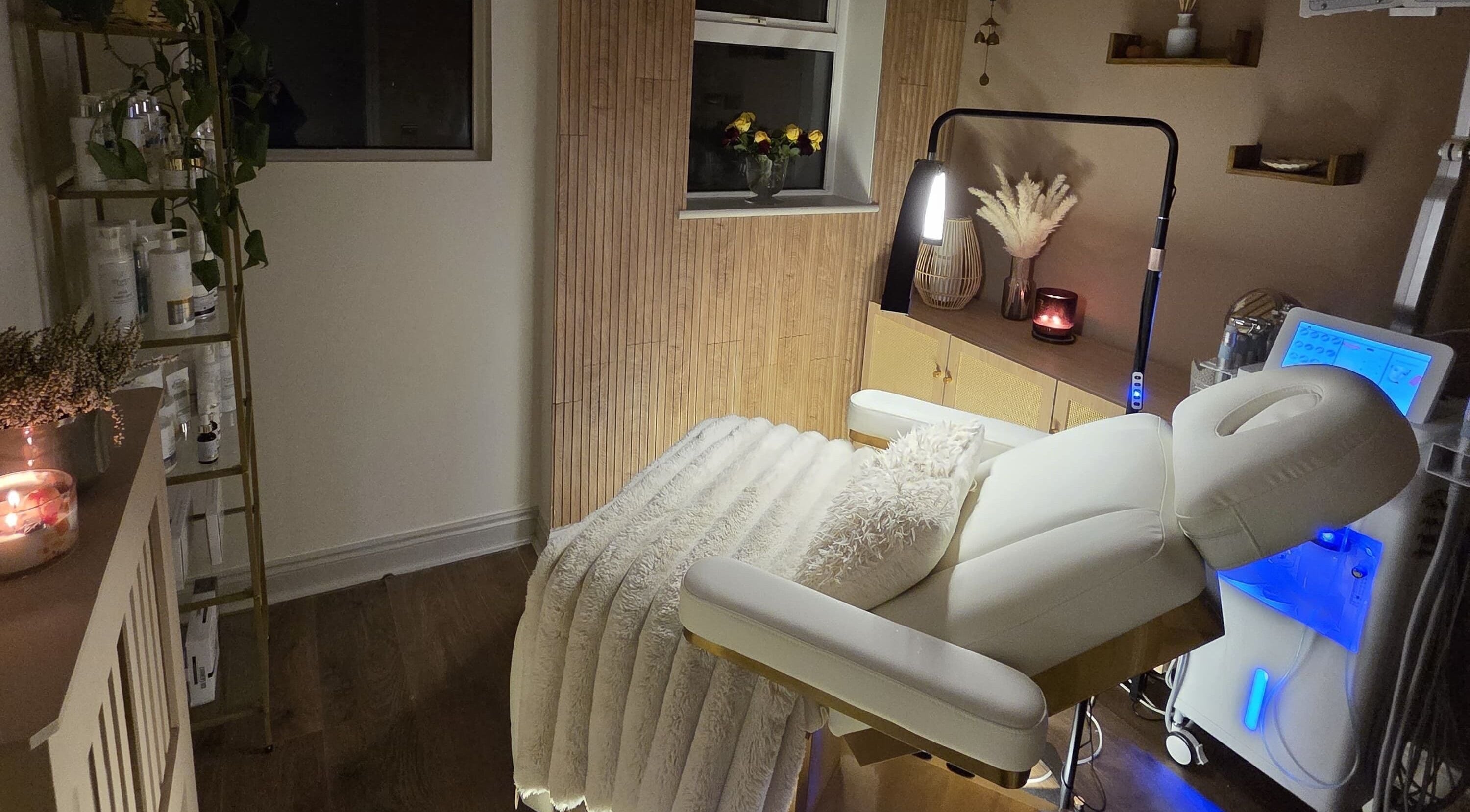 Elegant massage room at ReVivere Beauty Massage Wellness, London, England, GB, with soft lighting and modern decor.