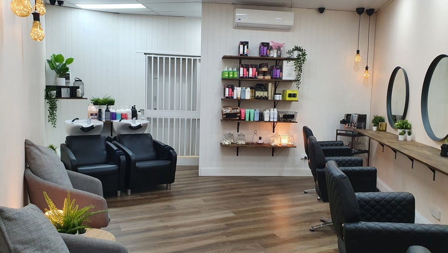 Contemporary salon interior at S&R Hair Studio, Hassall Grove, New South Wales, AU with modern chairs and decor.