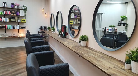 Modern salon setup at S&R Hair Studio, Hassall Grove, New South Wales, AU, featuring elegant mirrors and styling chairs.