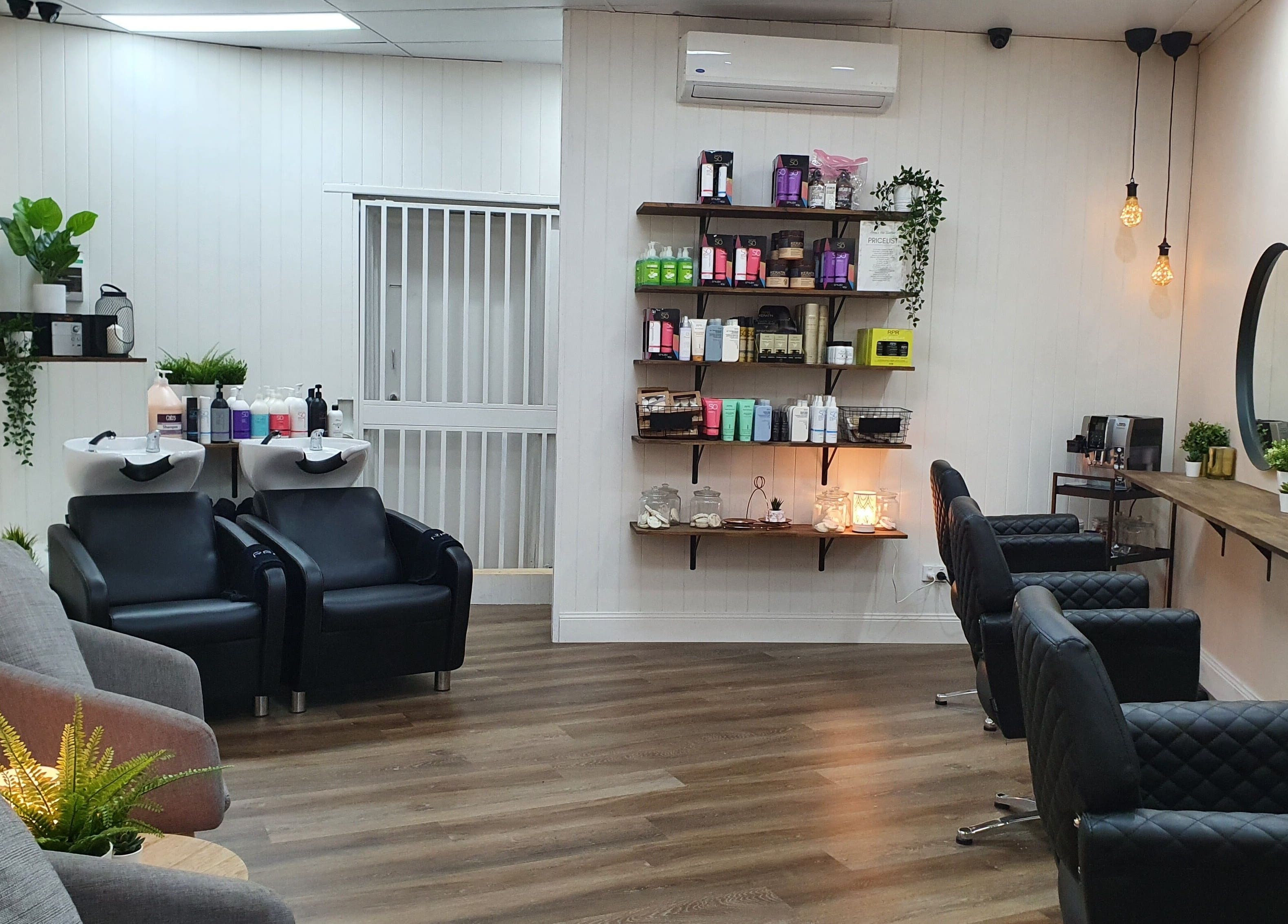 Elegant interior of S&R Hair Studio in Hassall Grove, New South Wales, AU with stylish chairs and product display.