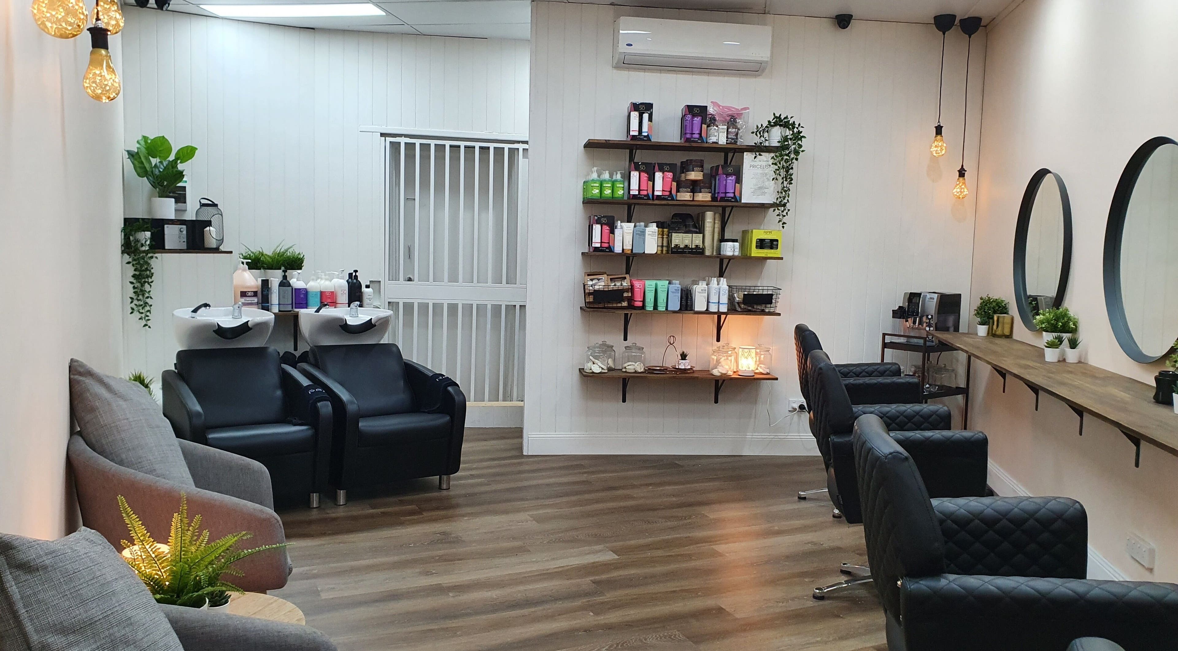 Elegant interior of S&R Hair Studio in Hassall Grove, New South Wales, AU with stylish chairs and product display.