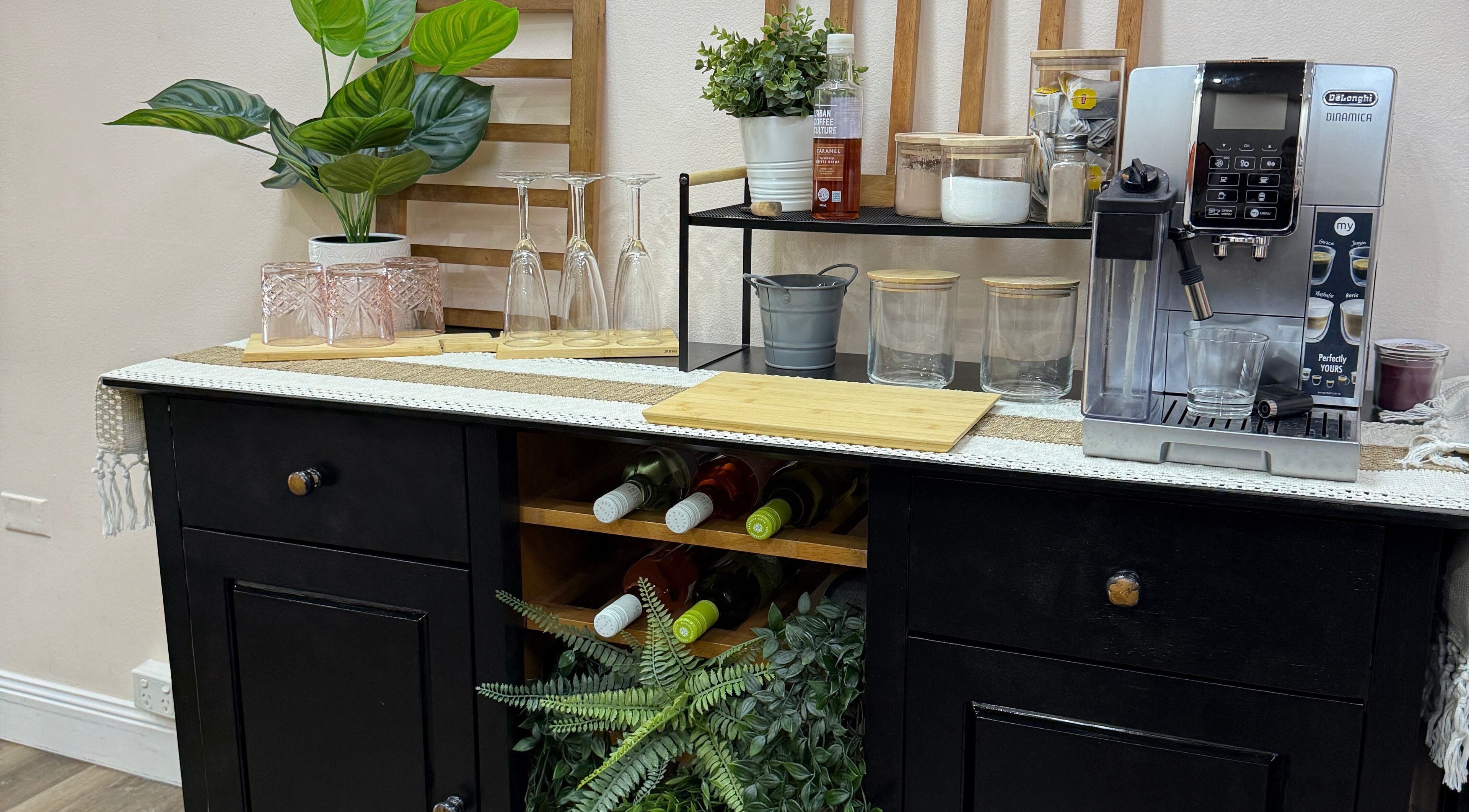 S&R Hair Studio in Hassall Grove, NSW, features a stylish coffee station with greenery, glasses, and a coffee machine.