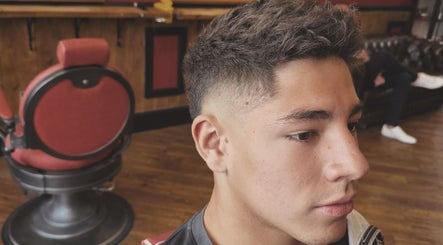Young man with a stylish fade haircut at Kings Barbers, Horsham, England, GB.