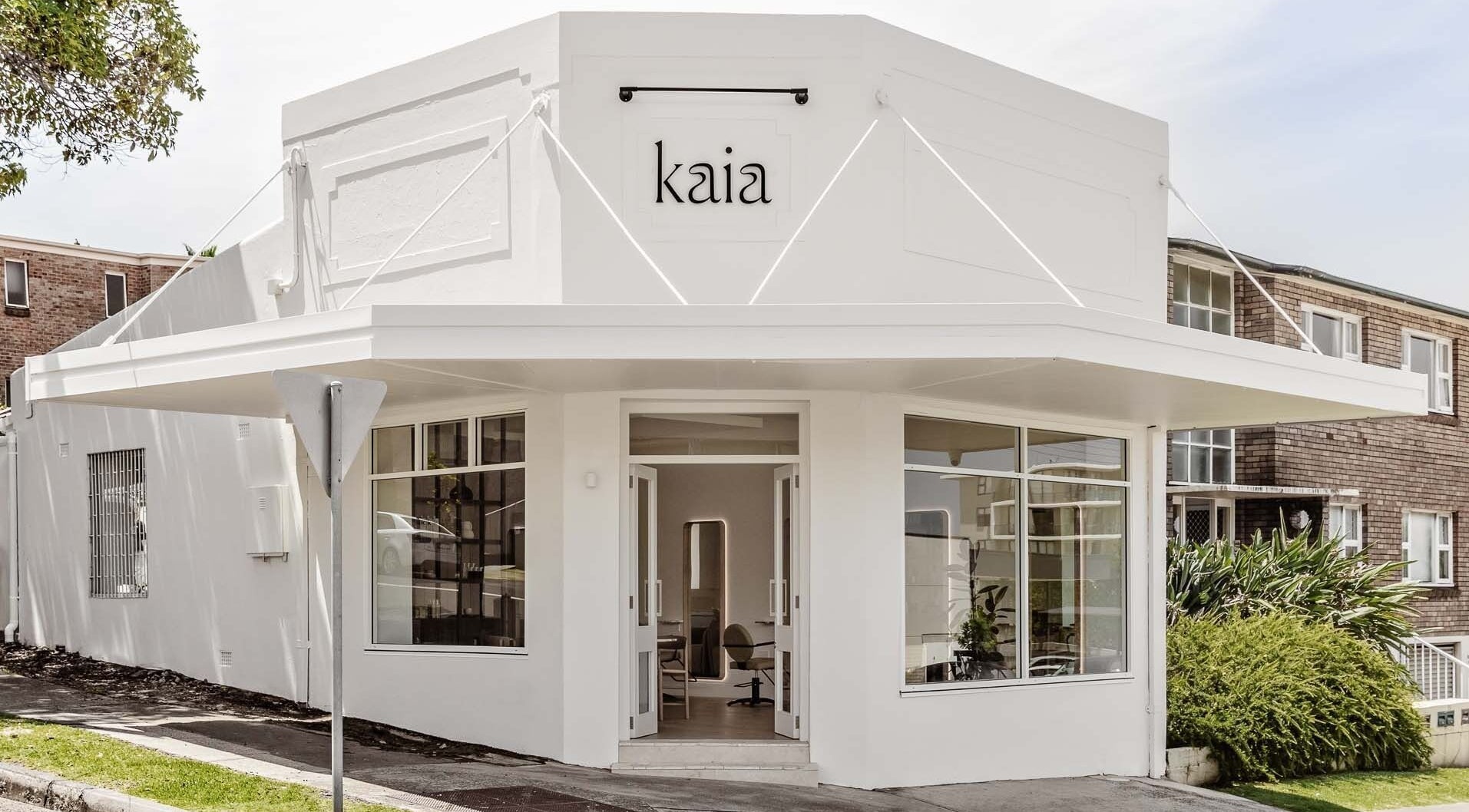 Exterior of Salon Kaia, a stylish beauty venue in Wollongong, NSW, AU, with modern white architecture.
