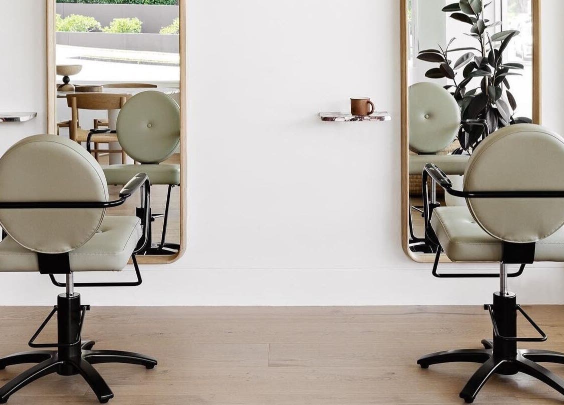 Elegant salon chairs and mirrors at Salon Kaia in Wollongong, NSW, AU create a welcoming beauty experience.