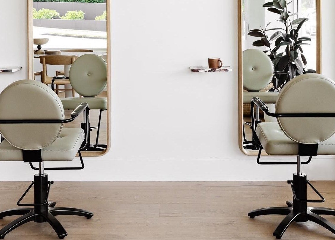 Elegant salon chairs and mirrors at Salon Kaia in Wollongong, NSW, AU create a welcoming beauty experience.